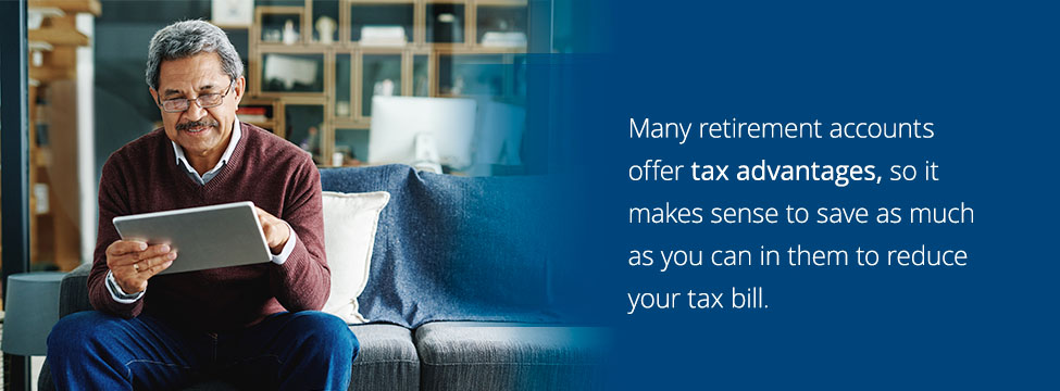 Older man using a tablet to manage his retirement accounts